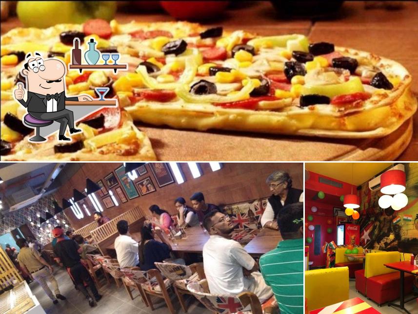 The photo of interior and pizza at William John's pizza mehsana