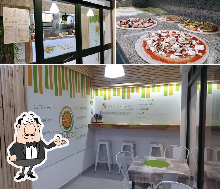 Guarda la immagine che raffigura la interni e pizza di Fit Pizza