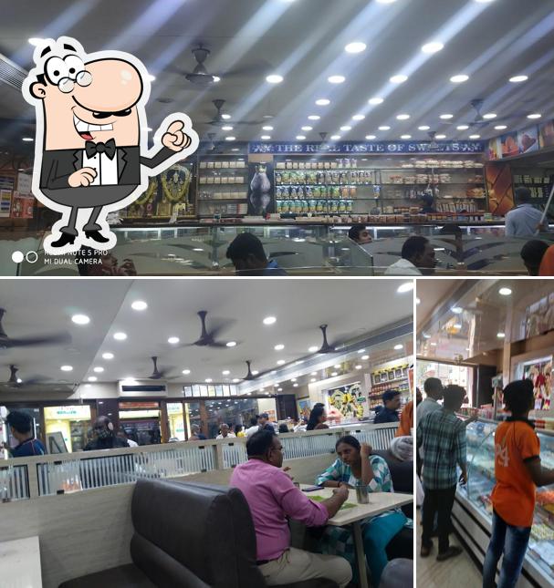 Take a seat at one of the tables at Perambur Sri Srinivasa Sweets (PS4) - Veg Restaurant