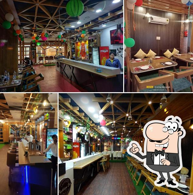 Take a seat at one of the tables at Indian Era Restaurant - Restaurant In Haridwar/ Cafe In Haridwar