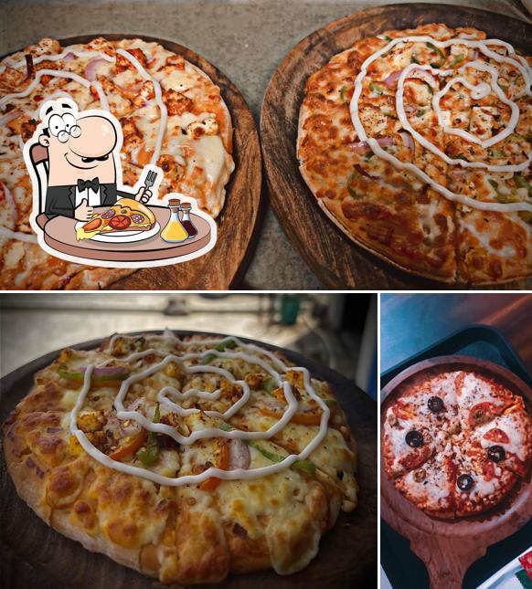 Get pizza at The Cafe Corner