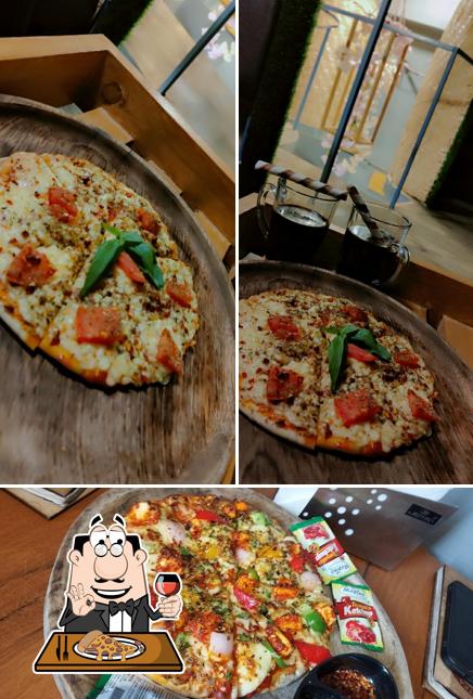 Get pizza at SUNRISER CAFE & RESTRO