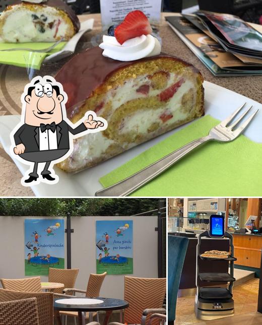La foto di interni e dolce da Cafe City