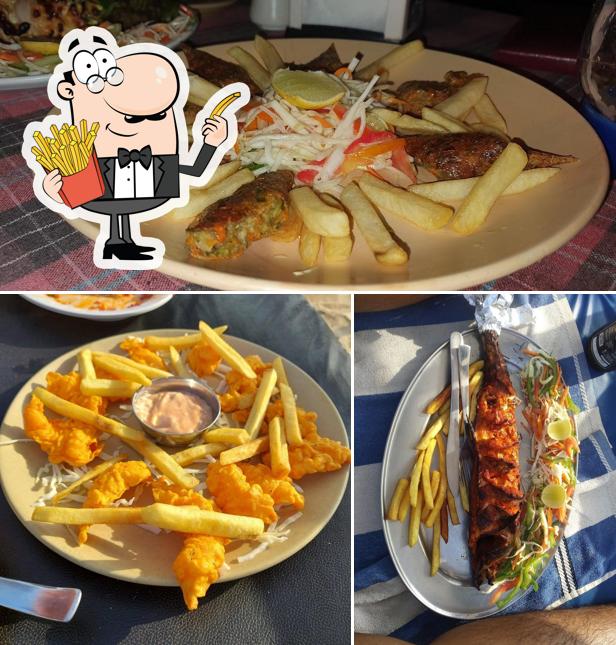 Order French fries at Pirates cabin restaurant and bar