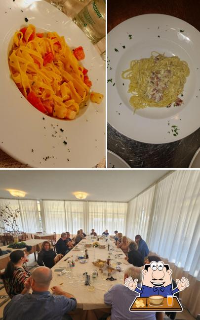 Questa è la immagine che presenta la cibo e interni di Al Caron