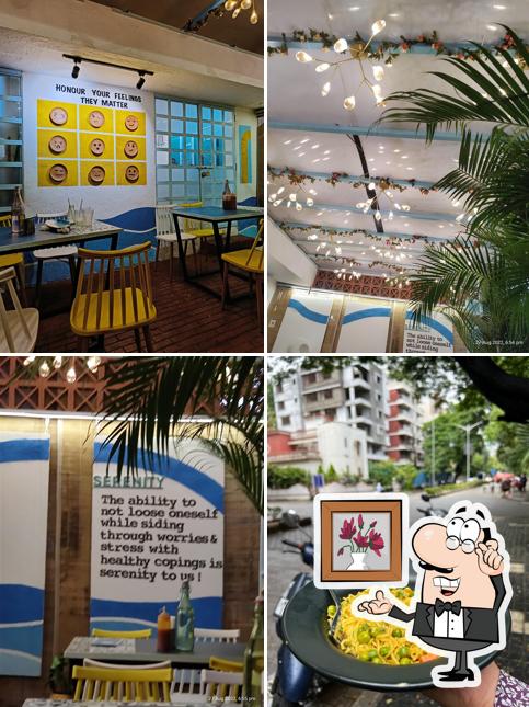 Take a seat at one of the tables at Cafe Serenity - All Day Kitchen & Coffee