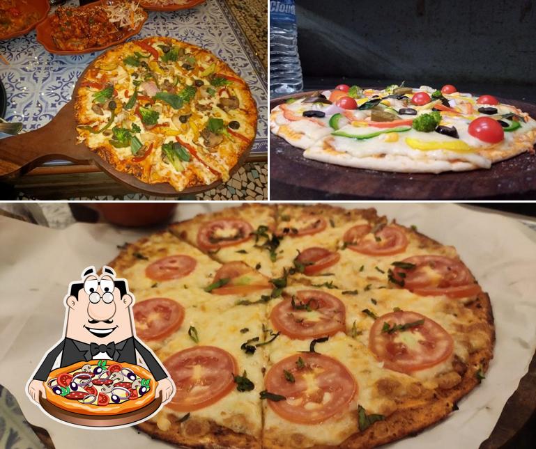 Get pizza at Mojito Cafe