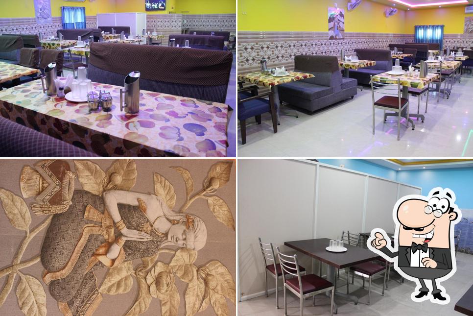 Take a seat at one of the tables at Srinivasa Family Restaurant