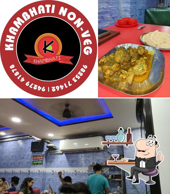 Take a seat at one of the tables at Khambhati Non Veg Restaurant