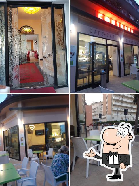 Siediti a un tavolo di Caffè Contrada Pub