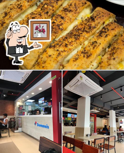 Among different things one can find interior and seafood at Domino's Pizza Chandkheda, Ahmedabad