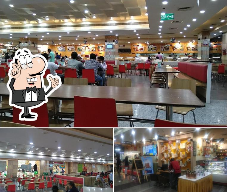 Take a seat at one of the tables at Haldiram's - MSX Mall