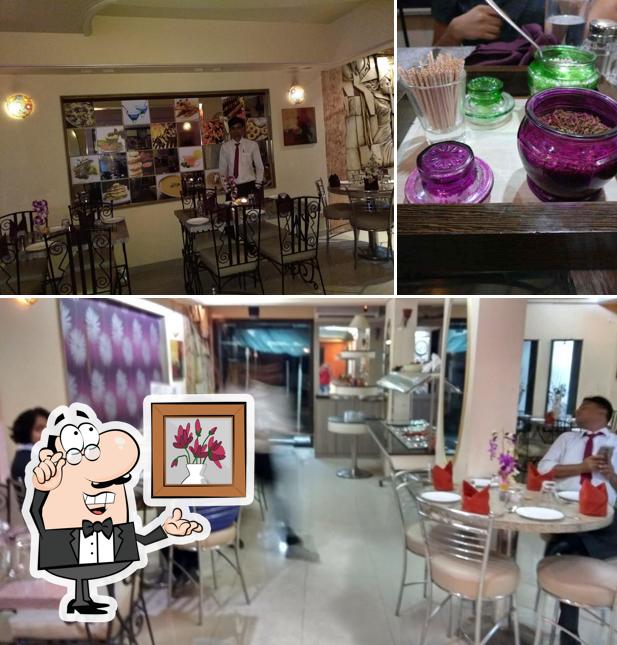 The photo of interior and dining table at Joys Khana khazana kitchen