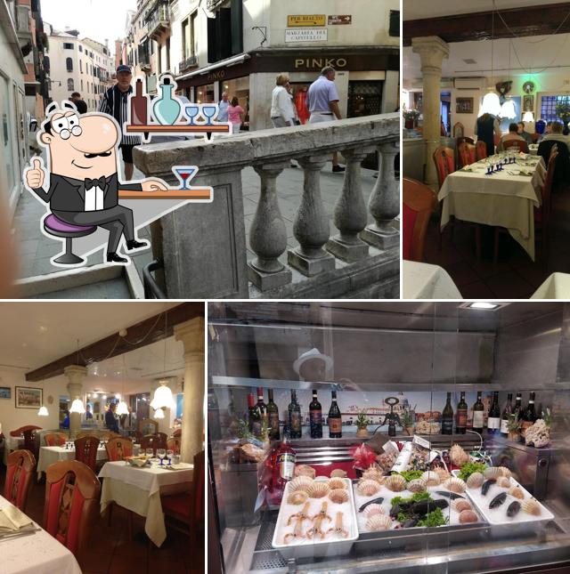 Siediti a un tavolo di Trattoria Alla Scala