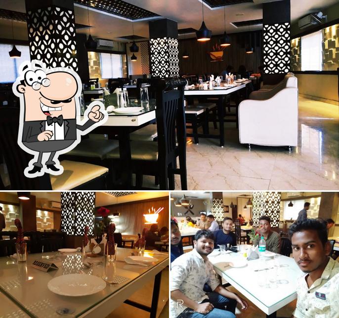 Check out the picture showing interior and dining table at Hot & Sour