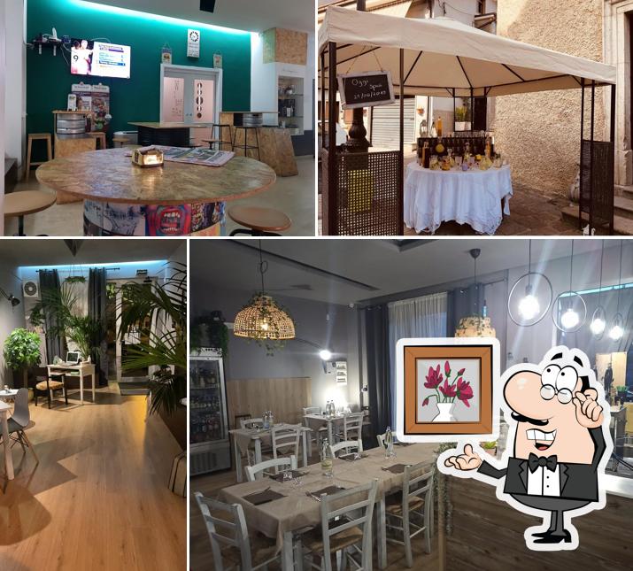 Siediti a un tavolo di PIZZERIA Be Happy
