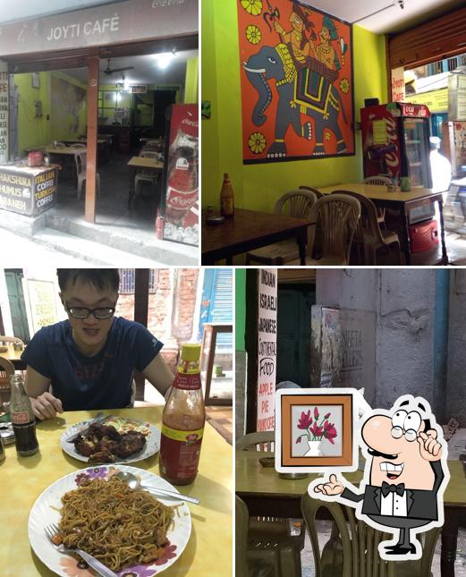 This is the picture depicting interior and dining table at Jyoti Cafe