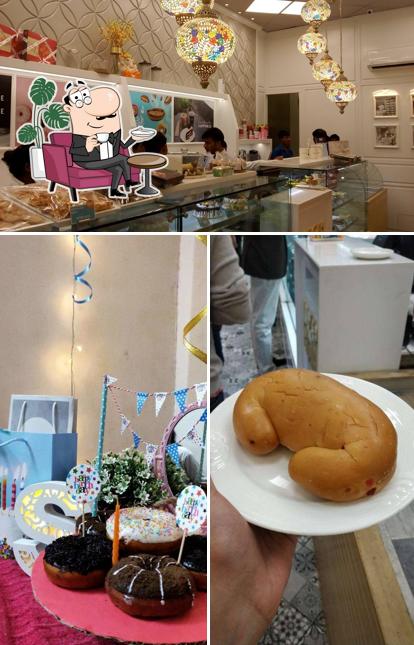 Take a look at the image displaying interior and food at M&H Bakery - A bakery by Madhurima