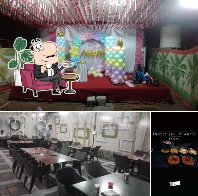 This is the photo displaying interior and food at Hotel Red N' White Veg Garden Restaurant