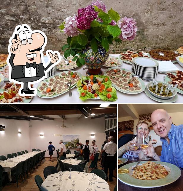 Ulisse Ristorante Pizzeria si caratterizza per la interni e tavolo da pranzo
