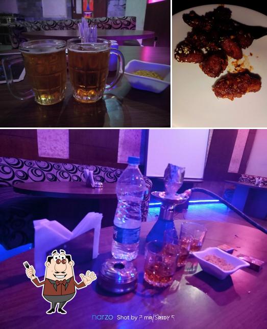 Take a look at the image displaying food and beer at The Pavillion Restaurant cum Lounge Bar