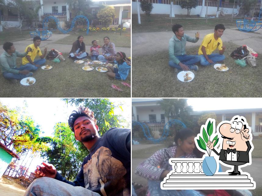 The photo of exterior and food at Madhu Hotel