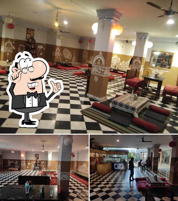 Take a seat at one of the tables at Aranya Vihar Restaurant&cafe(अरण्य विहार )