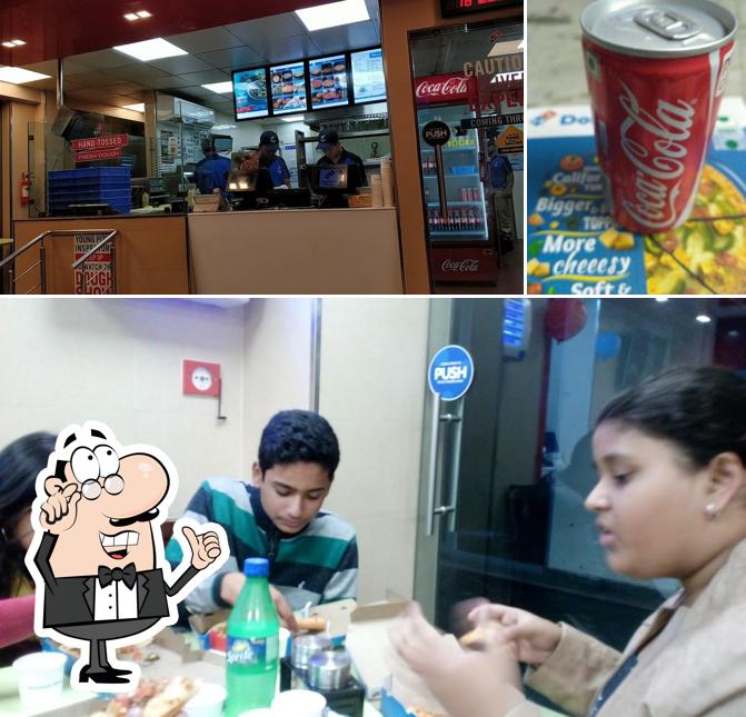 This is the photo depicting interior and beer at Domino's Pizza Kamla Nagar, Agra