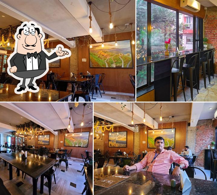 Take a seat at one of the tables at The Gangtok Kitchen - TGK