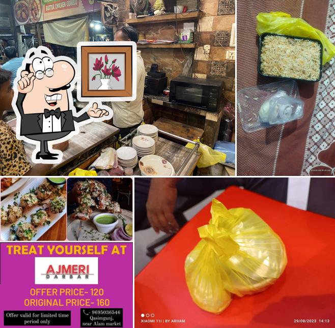 Take a seat at one of the tables at AJMERI DARBAR