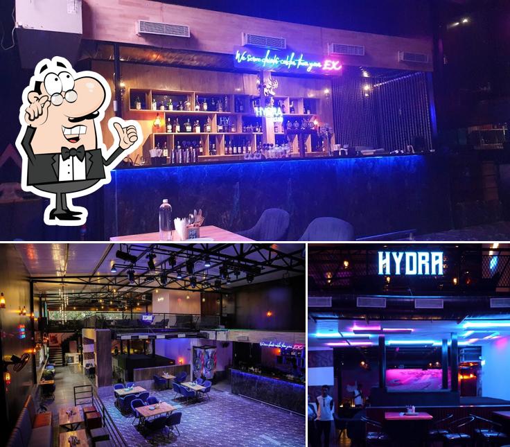 Take a seat at one of the tables at Hydra Club & Kitchen