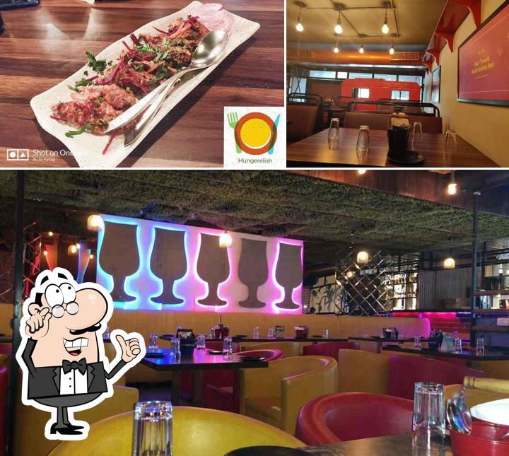 Take a seat at one of the tables at The Orange Truck Bar