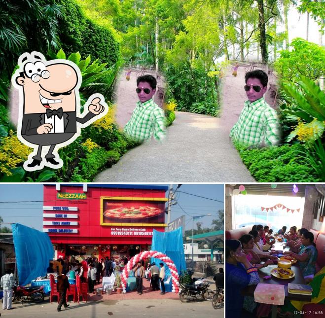 Take a look at the photo showing exterior and dining table at Meezzaah - Me And Mera Pizza - Raebareli