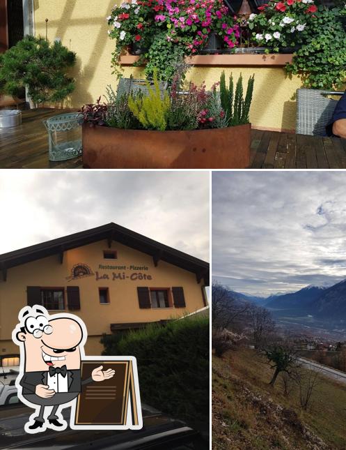 Puoi goderti l'aria fresca da seduto all'esterno di Restaurant La Mi-Côte