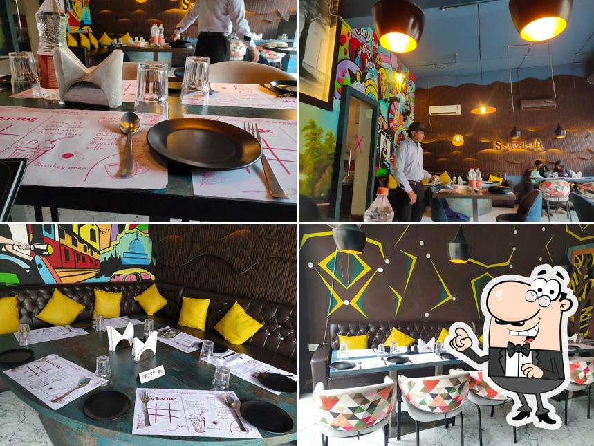 Take a seat at one of the tables at Sayeshaa Restro & Cafe