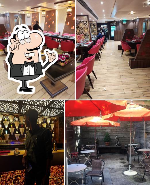 Take a seat at one of the tables at LE LION BAR