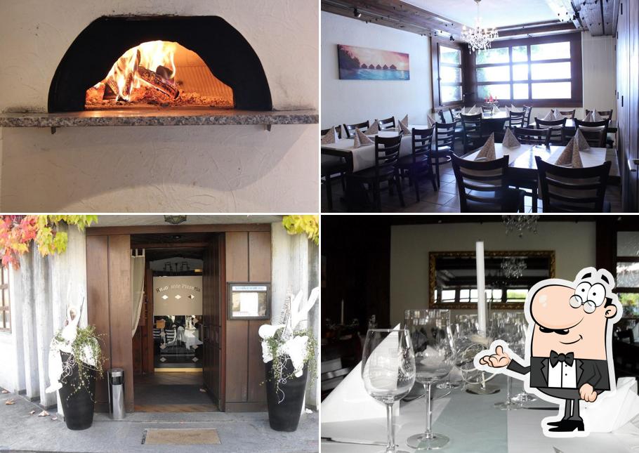 La interni e tavolo da pranzo del ristorante