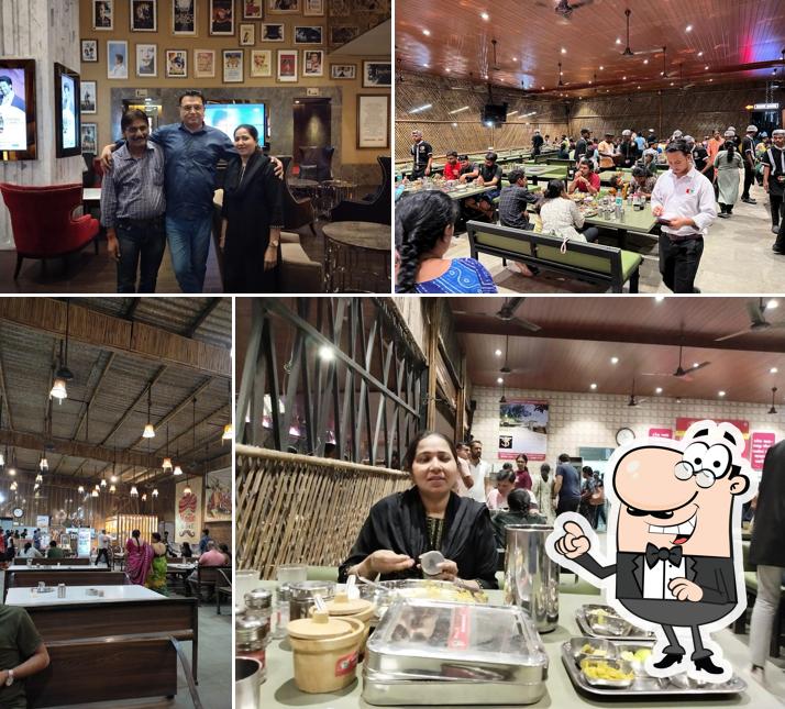 Take a seat at one of the tables at Shree Khodiyar Kathiyawadi Dhaba Vasai Mumbai