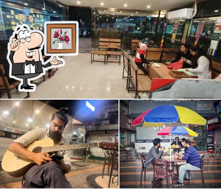 Take a seat at one of the tables at The Spot - Cafe