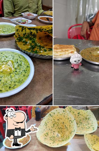 This is the photo displaying interior and dining table at MAHESH DHOSA CENTER