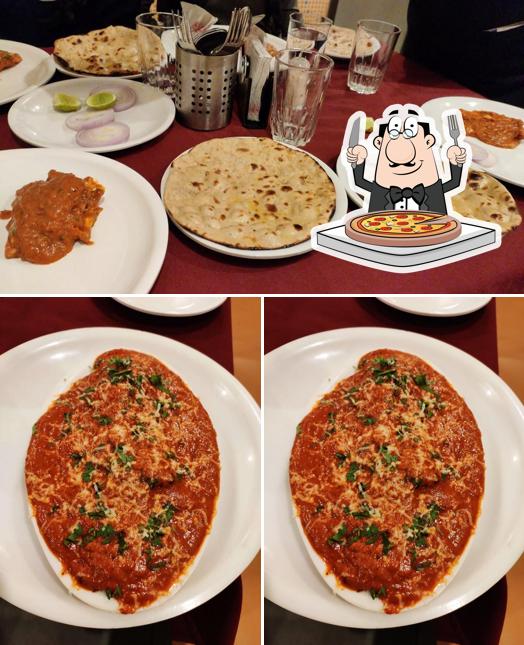 Try out pizza at Virajman Family Wine and Dine