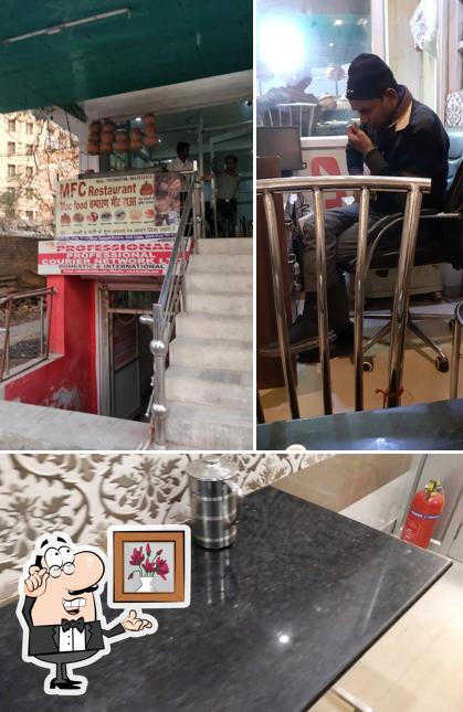 Take a seat at one of the tables at MFC Restaurant Champaran Meat House