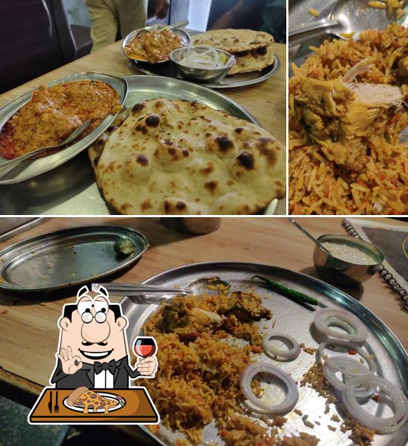 Try out pizza at Pooja Hotel