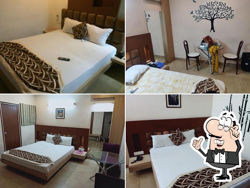 Take a seat at one of the tables at OYO Hotel Vaani Continental