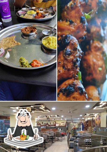 Among various things one can find food and interior at Hotel New Tanwani Veg Nonveg Family Restaurant and lodging