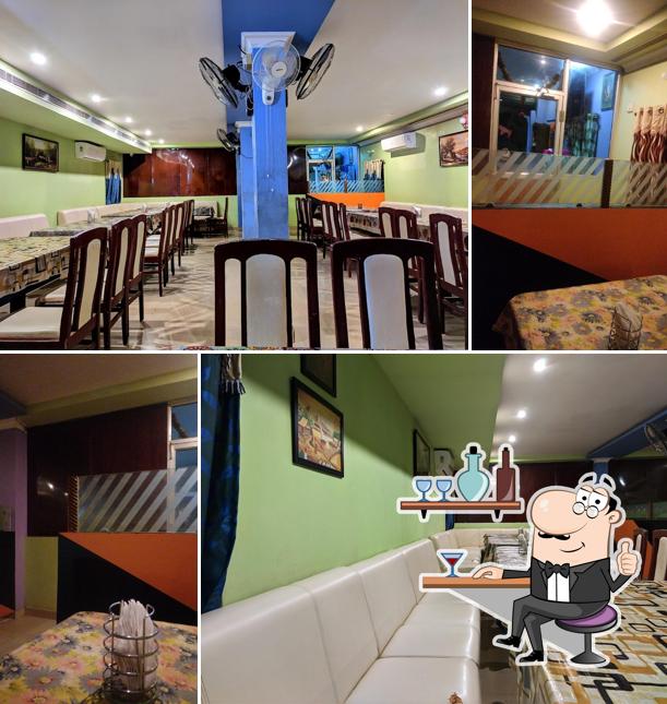 Take a seat at one of the tables at Sri Ram Family Restaurant