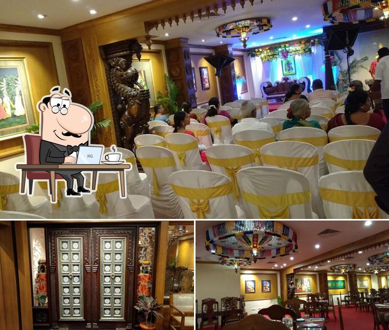 Take a seat at one of the tables at Annalakshmi Restaurant