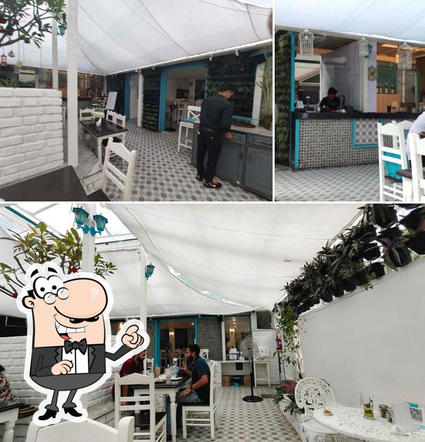 Take a seat at one of the tables at Cafe Azzure