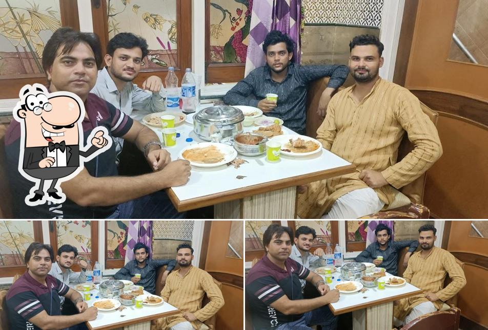 Take a seat at one of the tables at GULSHAN-E-KARIM