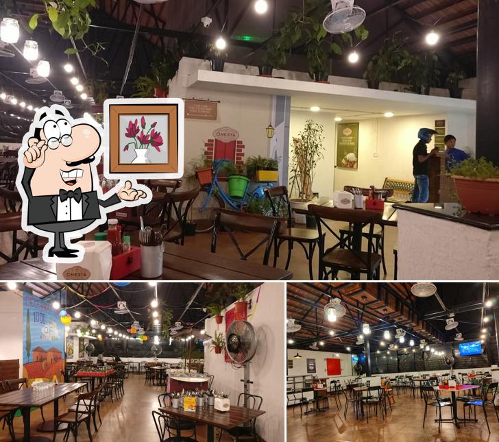 Take a seat at one of the tables at Onesta Yelahanka